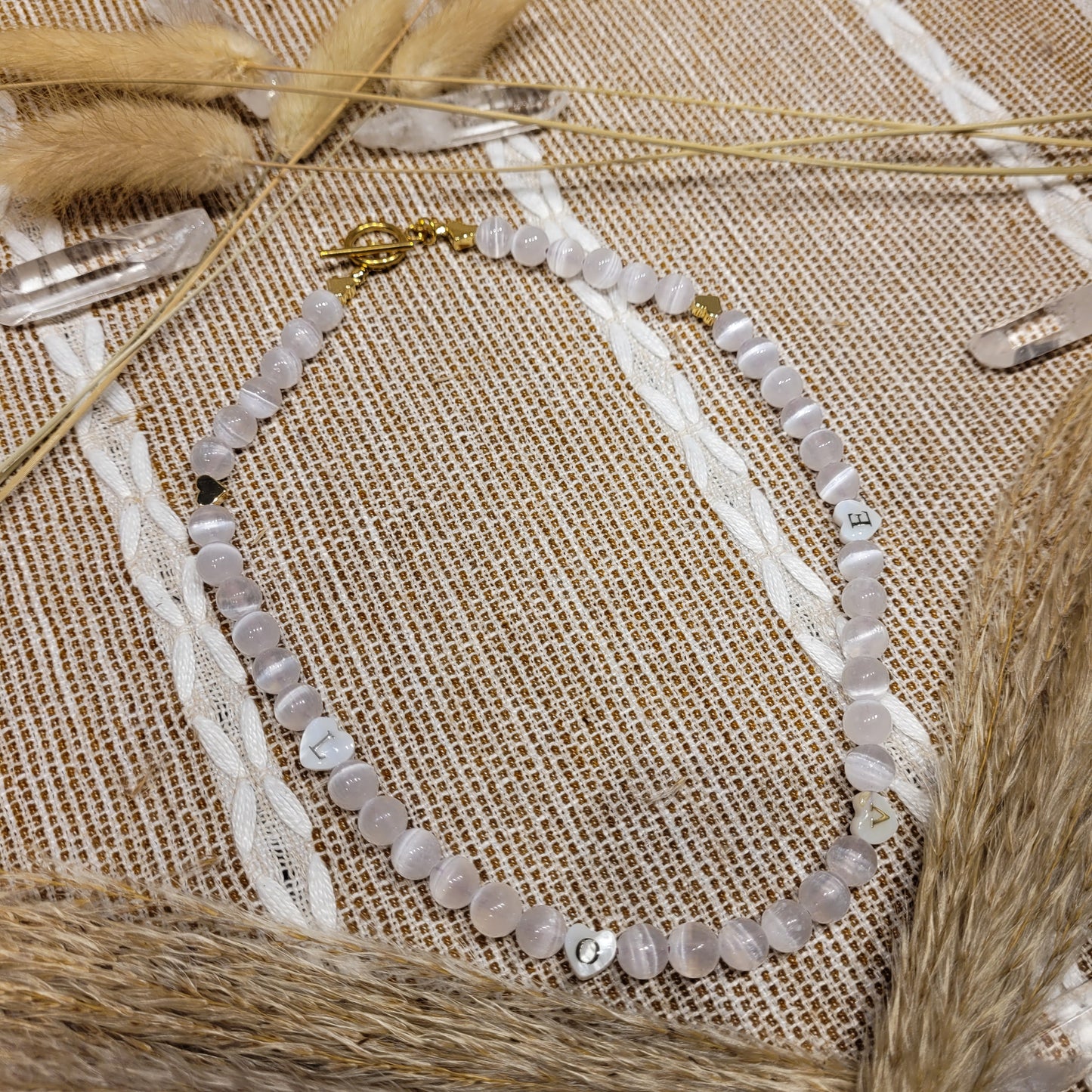 Selenite necklace with gold plated hearts and mother of pearl word heart beads